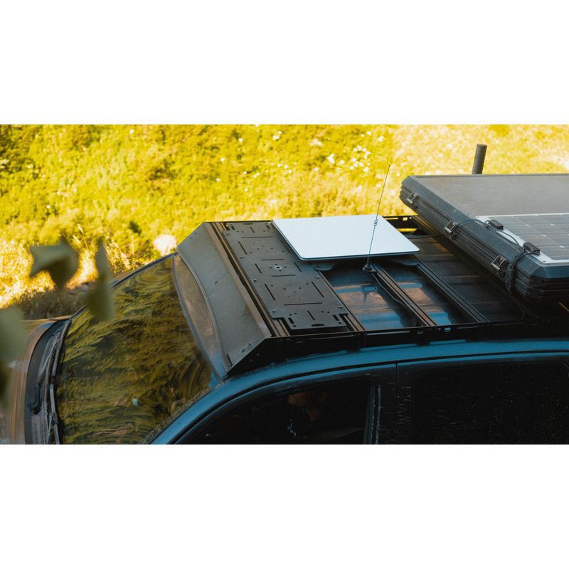 sherpa-adapt-plate-large-front-corner-view-on-vehicle-in-nature