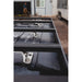 sherpa-adjustable-track-mounting-feet-front-corner-view-with-person-on-vehicle-in-garage