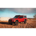 sherpa-animas-2005-2023-tacoma-camper-roof-rack-front-corner-view-on-red-tacoma-in-nature