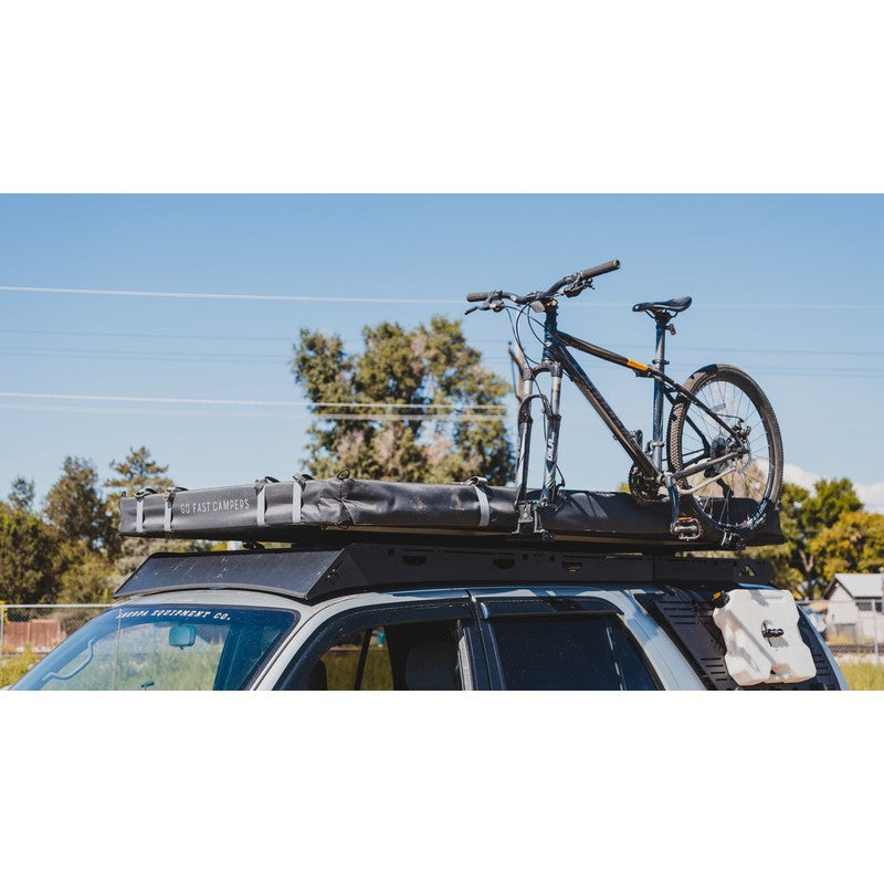 sherpa-crossbar-riser-front-corner-view-on-vehicle-with-bike-in-nature