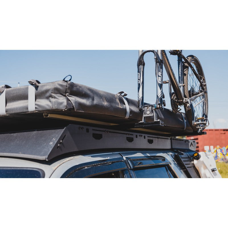 sherpa-crossbar-riser-front-corner-view-on-vehicle-with-bike