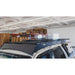 sherpa-crossbar-riser-front-corner-view-with-corssbar-on-vehicle-in-garage