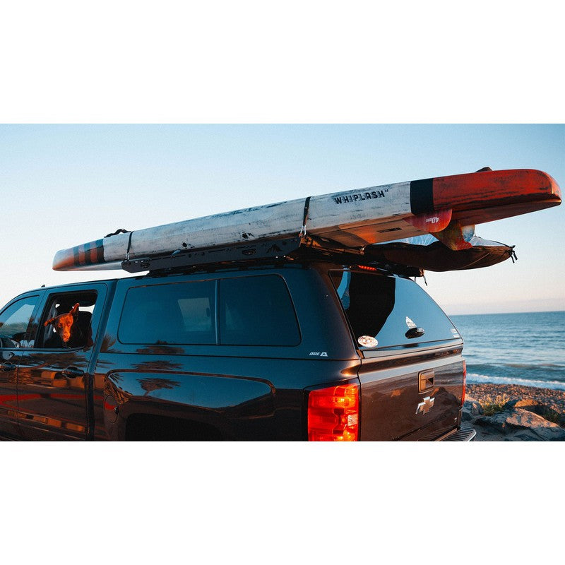 sherpa-crows-nest-truck-topper-rack-rear-corner-view-on-chevrolet-silverado-with-kayak-at-the-beach