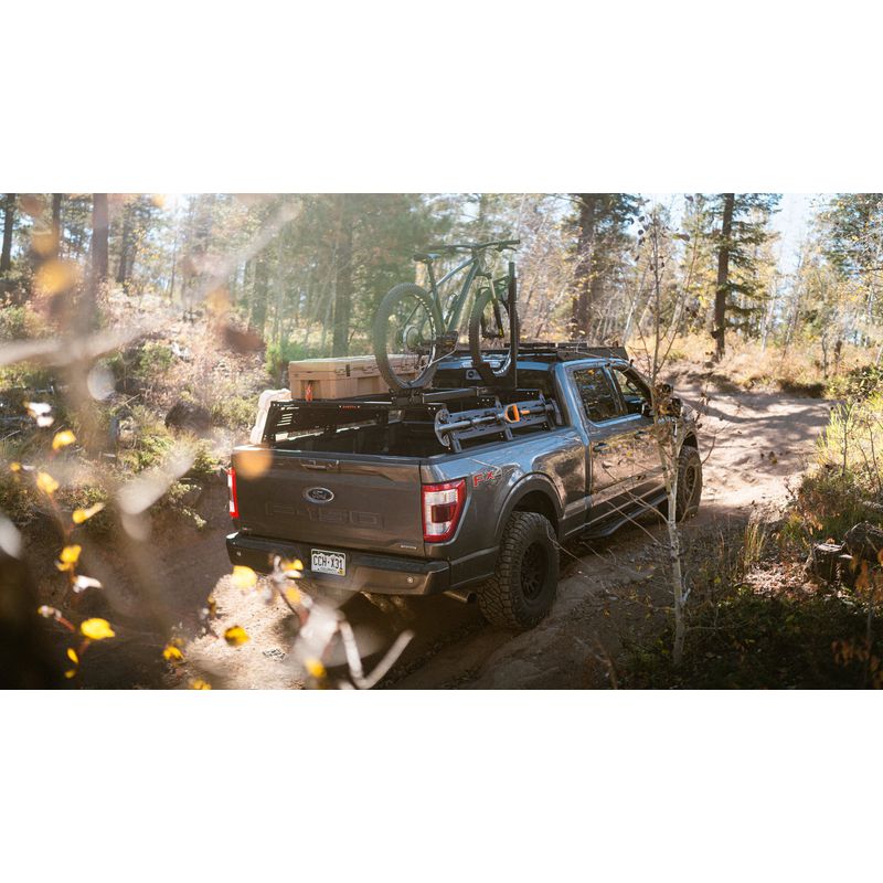 sherpa-mid-height-pak-system-bed-rack-rear-corner-view-on-ford-f150-in-nature