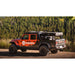 sherpa-mid-height-pak-system-bed-rack-rear-corner-view-on-jeep-gladiator-in-nature