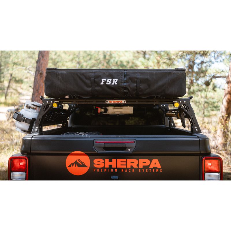 sherpa-mid-height-pak-system-bed-rack-rear-view-on-vehicle-in-nature