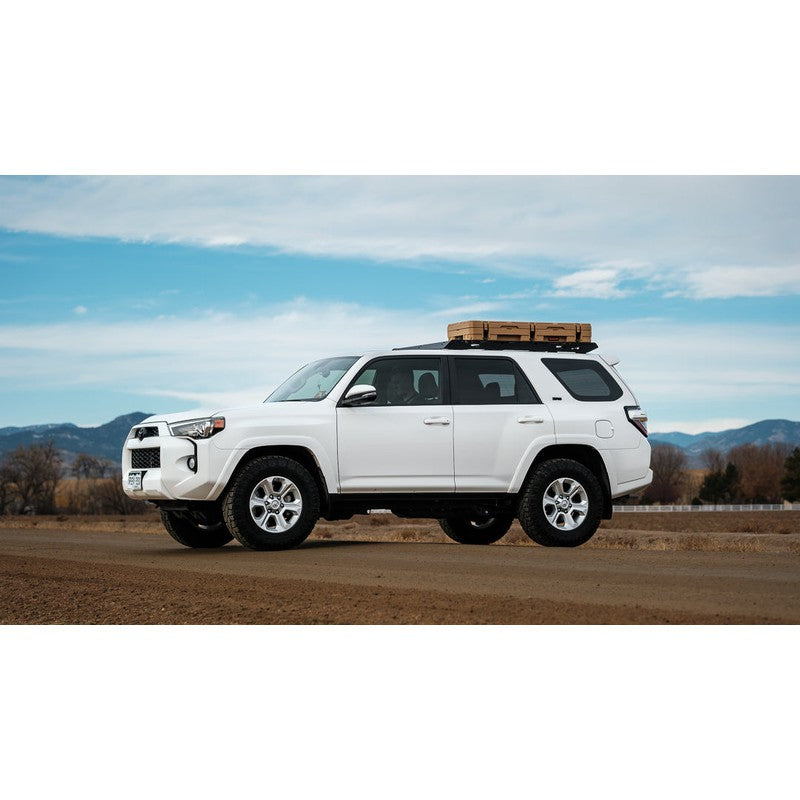 sherpa-needle-roof-rack-for-2010-2024-4runner-front-corner-view-with-roam-case-in-nature
