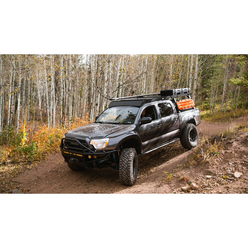 sherpa-rack-height-pak-system-bed-front-corner-view-on-tacoma-in-nature