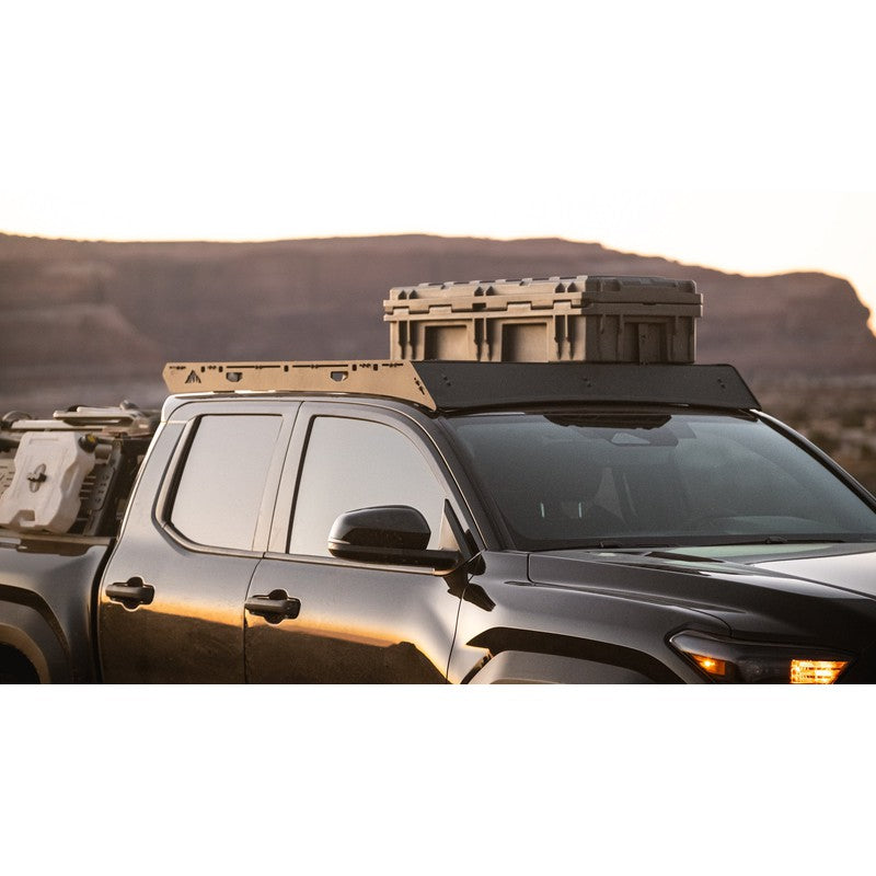 sherpa-rainier-roof-rack-for-2024-tacoma-double-cab-front-corner-view-with-roam-case-in-terrain