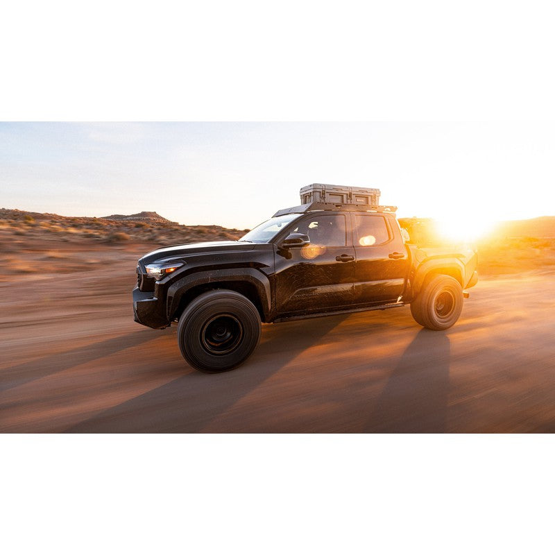 sherpa-rainier-roof-rack-for-2024-tacoma-double-cab-side-view-with-roam-case-in-terrain