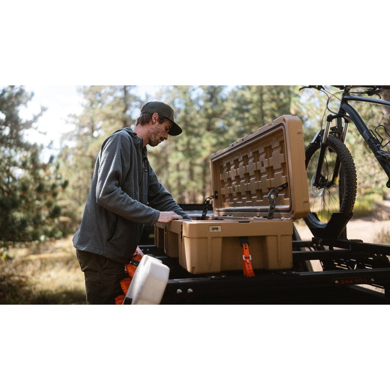 sherpa-roam-case-and-cooler-tie-downs-front-view-with-person-case-in-nature