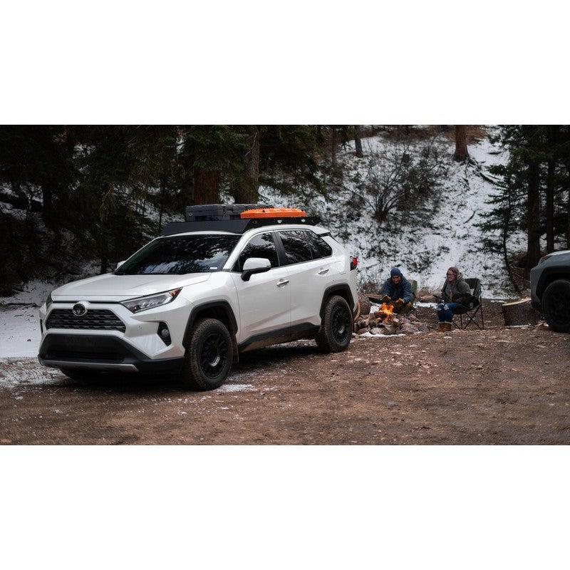 sherpa-snowmass-roof-rack-for-2019-2024-rav4-front-corner-view-with-persons-on-background-in-nature