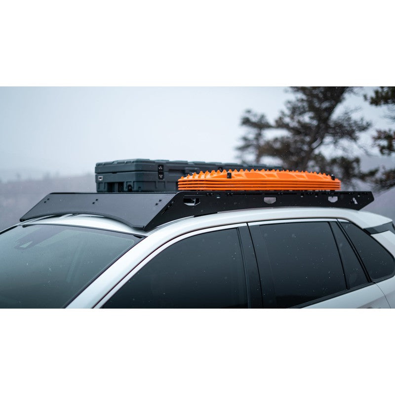sherpa-snowmass-roof-rack-for-2019-2024-rav4-side-view-with-traction-board-in-nature