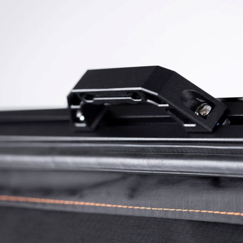 tentbox-cargo-hard-shell-roof-top-tent-black-open-close-up-view-with-handle-on-white-background