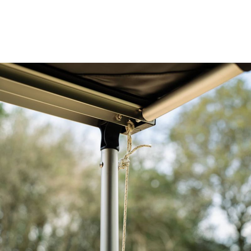 tentbox-cargo-side-awning-open-close-up-view-with-knotted-ropes-on-awning-in-nature