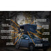 tentbox-classic-2-hard-shell-roof-top-tent-midnight-gray-open-front-corner-view-on-dacia-duster-with-exterior-features-in-nature