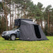 tentbox-classic-2-living-pod-front-corner-view-on-dacia-duster-in-forest