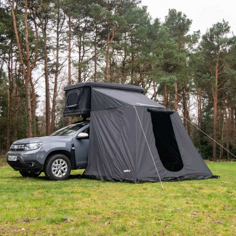 tentbox-classic-2-living-pod-front-corner-view-on-dacia-duster-in-forest