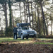 tentbox-go-hybrid-roof-top-tent-black-closed-rear-view-on-vehicle-with-man-in-nature
