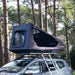 tentbox-go-hybrid-roof-top-tent-black-open-front-corner-view-on-vehicle-in-nature