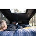 tentbox-go-hybrid-roof-top-tent-black-open-interior-view-with-man-resting-in-nature