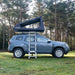 tentbox-go-hybrid-roof-top-tent-black-open-side-view-on-vehicle-with-ladder-in-nature