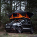 tentbox-lite-2-0-soft-shell-roof-top-tent-sunset-orange-open-front-corner-view-on-fiat-panda-cross-in-forest