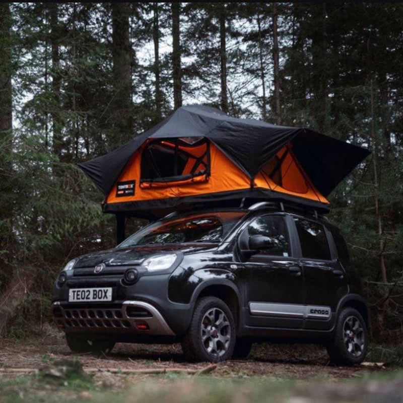 tentbox-lite-2-0-soft-shell-roof-top-tent-sunset-orange-open-front-corner-view-on-fiat-panda-cross-in-forest