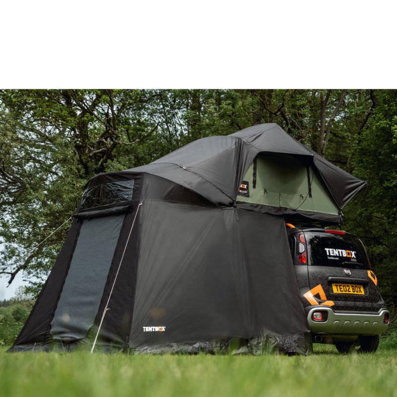 tentbox-lite-xl-living-pod-black-open-side-view-with-mesh-windows-on-fiat-panda-cross-in-nature