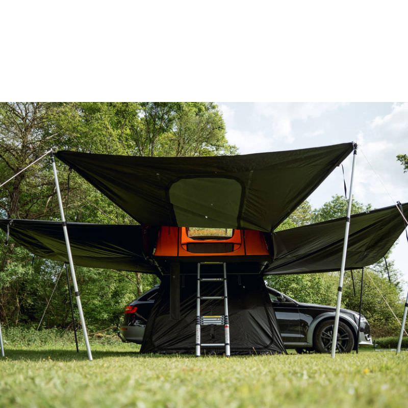 tentbox-lite-xl-living-pod-black-wing-mode-open-front-view-with-telescopic-poles-on-vehicle-in-nature