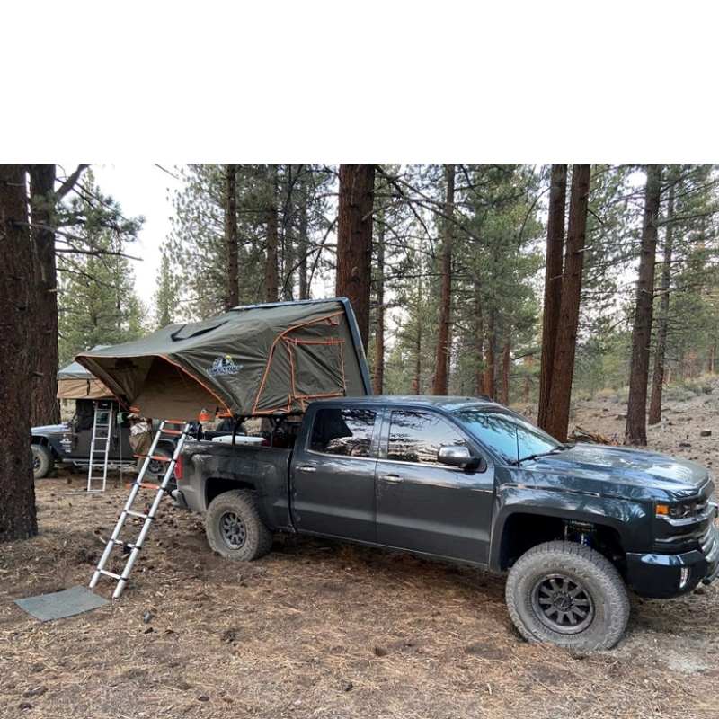 tuff-stuff-alpha-hard-shell-roof-top-tent-2-3-person-gray-open-on-vehicle-in-nature
