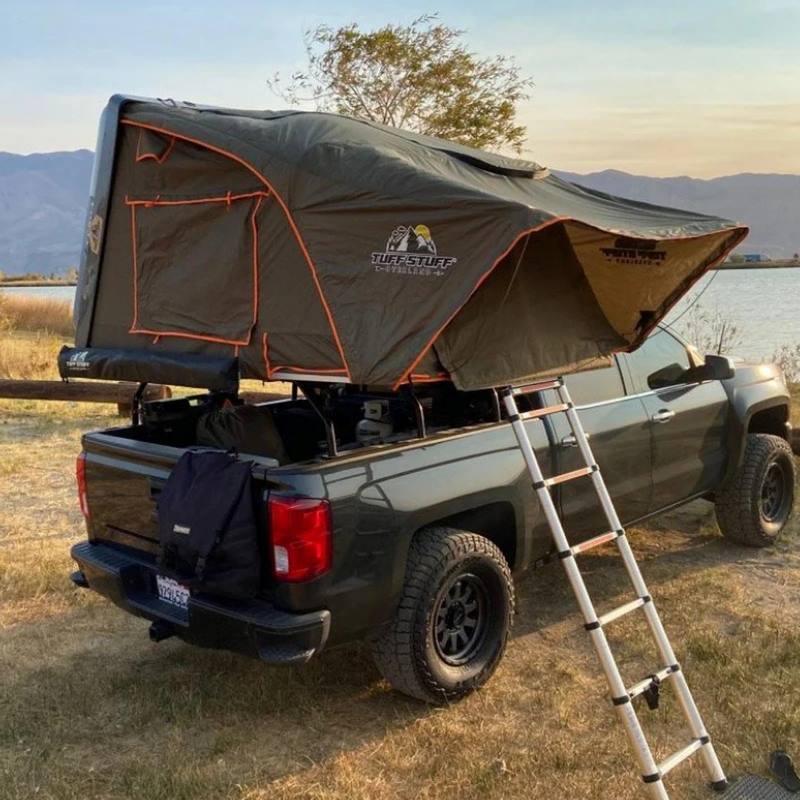 tuff-stuff-alpha-hard-shell-roof-top-tent-2-3-person-gray-open-with-ladder-on-vehicle