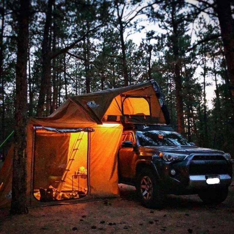 tuff-stuff-alpha-hard-shell-roof-top-tent-2-3-person-with-annex-open-side-view-on-toyota-4runner-in-nature