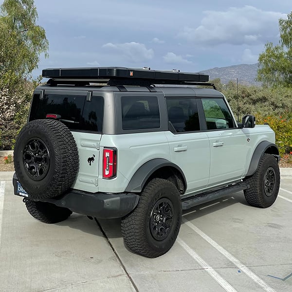 badass-tents-recon-pop-up-roof-top-tent-closed-rear-side-view-on-ford-bronco