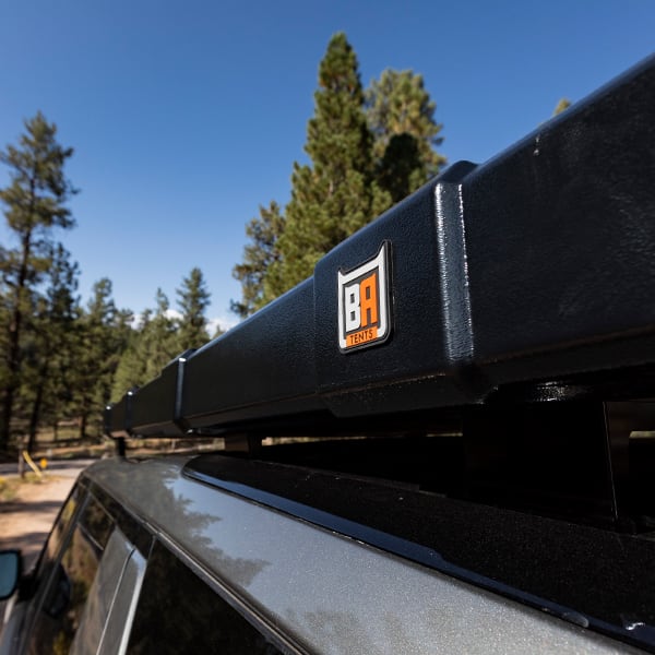 badass-tents-rugged-clamshell-roof-top-tent-closed-low-profile-view-on-land-rover-discovery-5