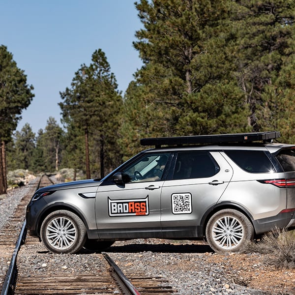 badass-tents-rugged-clamshell-roof-top-tent-closed-side-view-on-land-rover-discovery-5